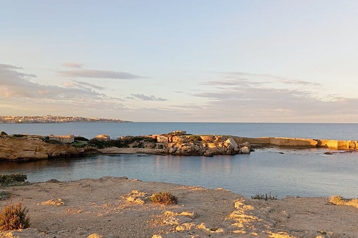 Beach at sunset near Plemmirio Marine Park, Sicily