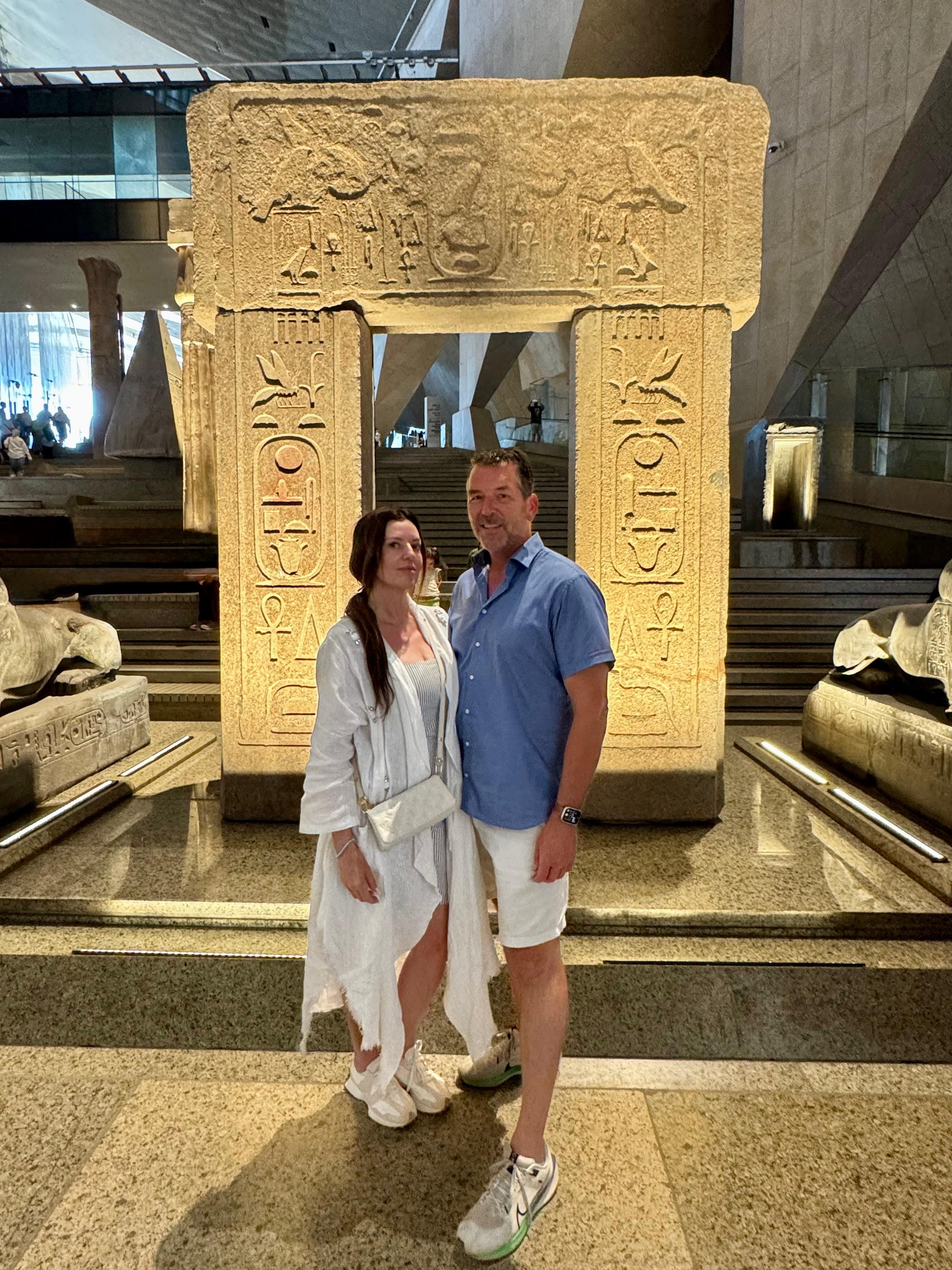 Couples posing at the Grand Egyptian Museum during Egypt honeymoon packages.