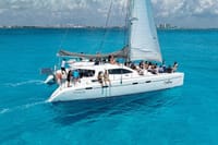 Dive into the magnificent reefs and clear turquoise water for a spectacular private snorkeling stop on your custom Cancun Catamaran cruise!