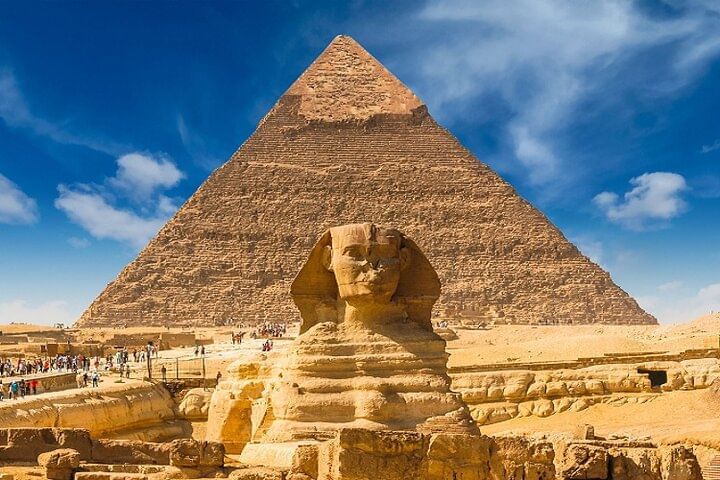 A scenic view of the Pyramids of Giza from the tour vehicle on a private excursion.