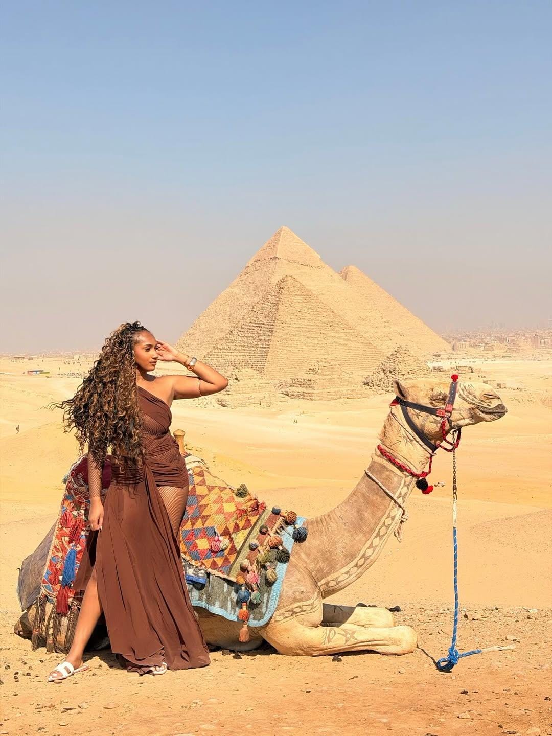 Guests enjoying camel rides on Egypt vacation packages.