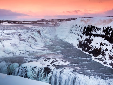the milky water of the river cascading down into the gorge of Gullfoss waterfall