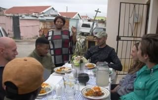 Share a tasty home-cooked meal while immersed in township stories and laughter.