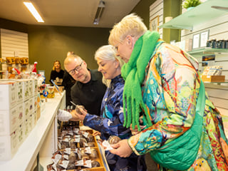 Travellers browsing a local speciality store.