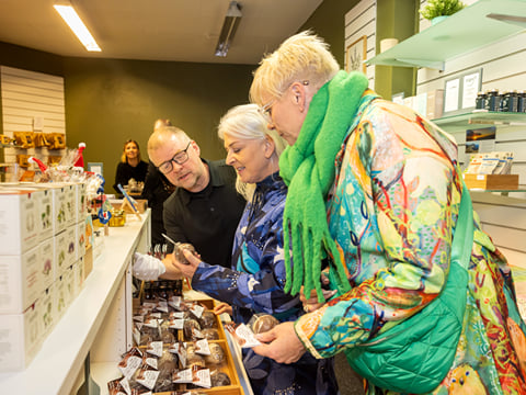 Travellers browsing a local speciality store.