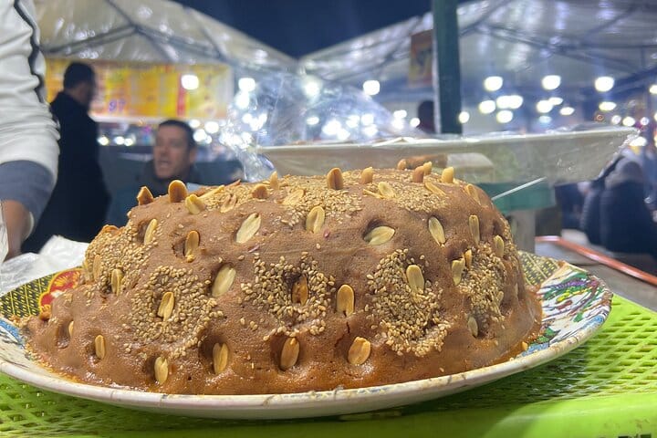 Slilo; different nuts with roasted flour, honey and sesame seeds