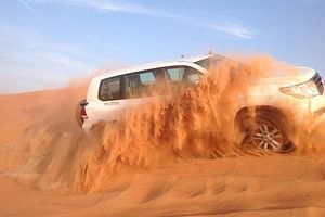 Dubai Desert Safari with BBQ And 4W Land Cruiser Dune Bashing Experience-Sandboarding From Sharjah