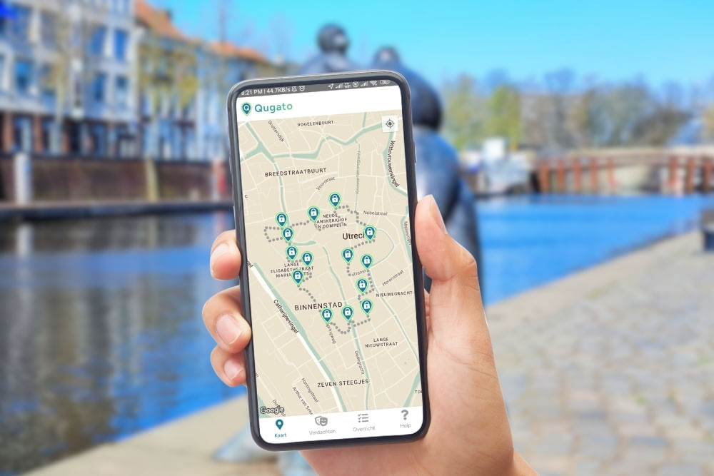 Phone showing the Qugato app interface of the Breda City Detective game.