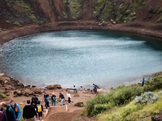 Aerial view of volcanic crater in Iceland surrounded by rugged landscape