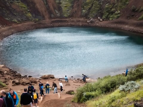 Aerial view of volcanic crater in Iceland surrounded by rugged landscape