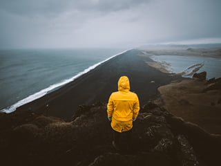 A traveller stranding at Reynisfjara, the Black Beach