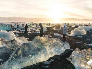 People wondering around and taking in diamond beach during 4 day tour Iceland