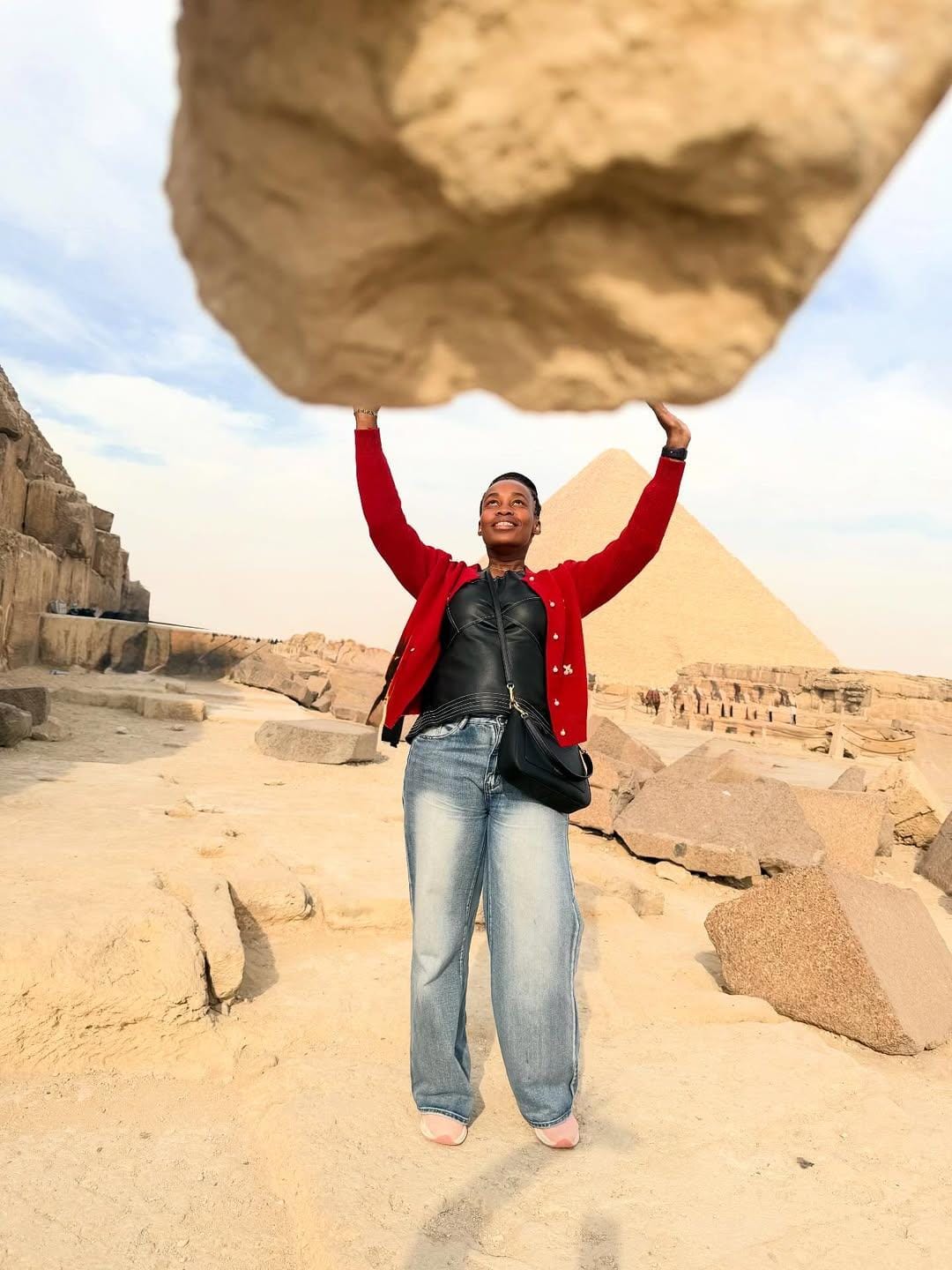 Visitor exploring Khufu Pyramid, capturing pyramid photography Egypt.