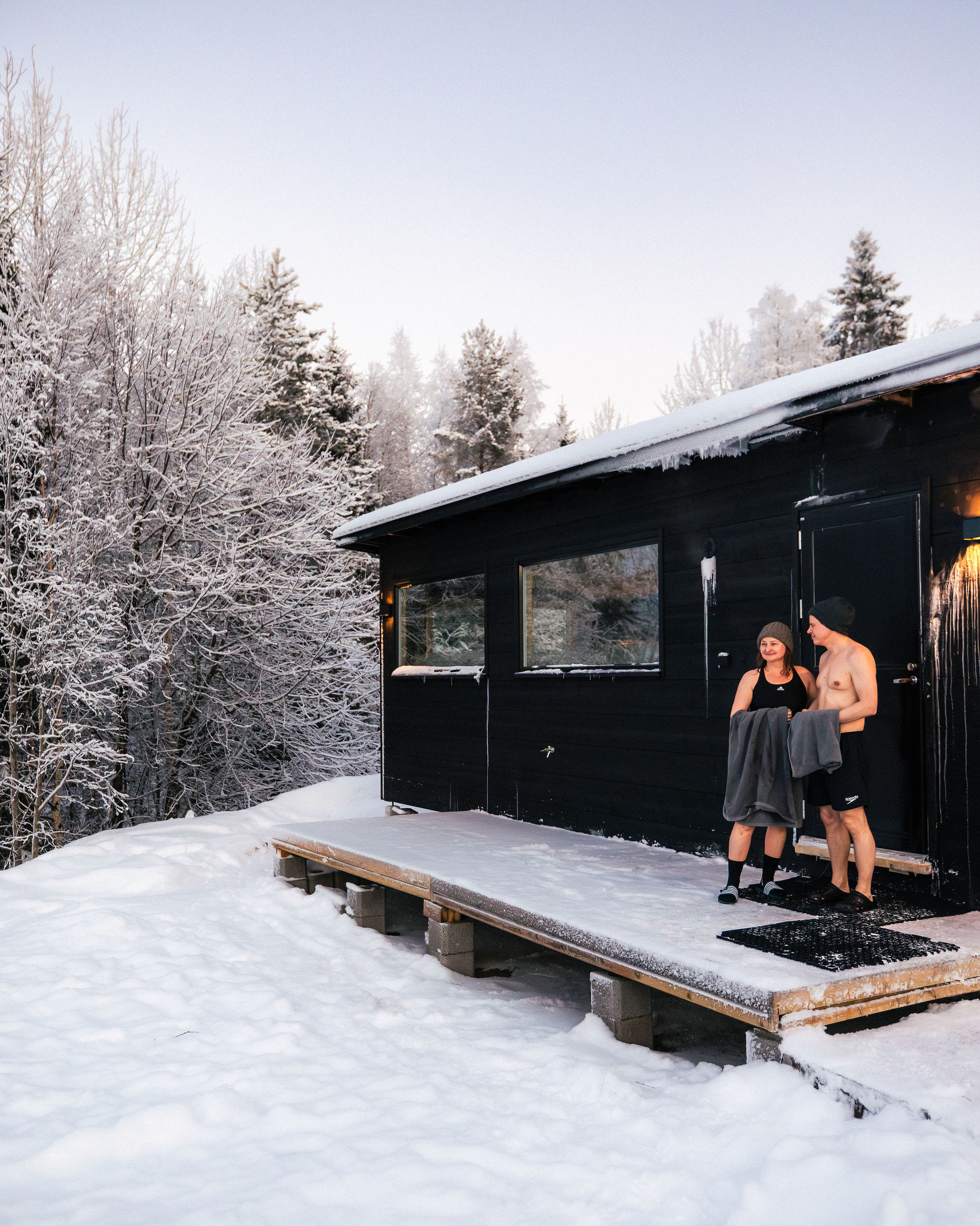 A couple stepping out of sauna