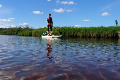 Arctic summer SUP boarding on a lake and river