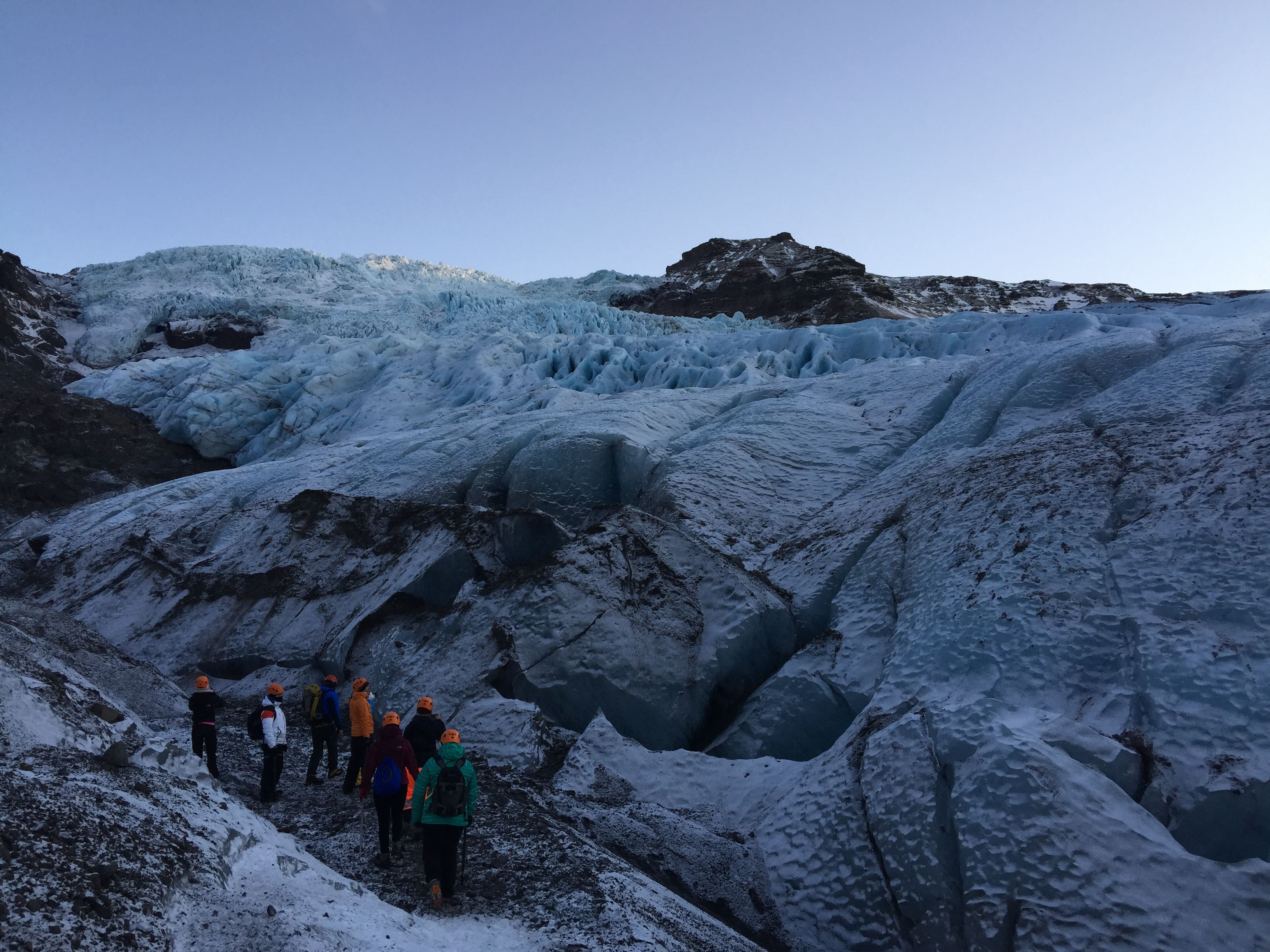 A group of people exploring glacier during Arctic adventures 2 day south coast tour