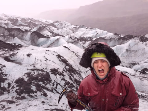 Woman screaming like a Viking on the glacier.