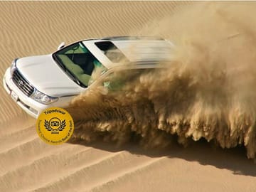 Quad bike ride qatar Dune bashing desert safari ATV inland sea by falcon tours