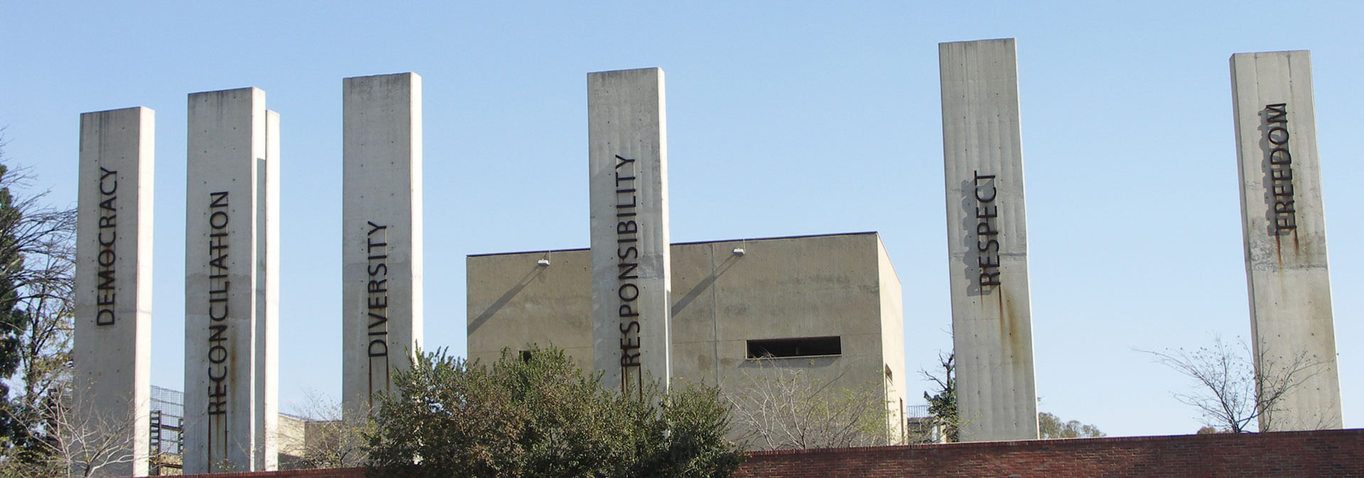 Apartheid Museum pillars representing democracy, reconciliation, diversity, and freedom.