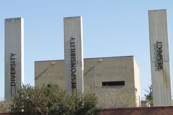 Apartheid Museum pillars representing democracy, reconciliation, diversity, and freedom.