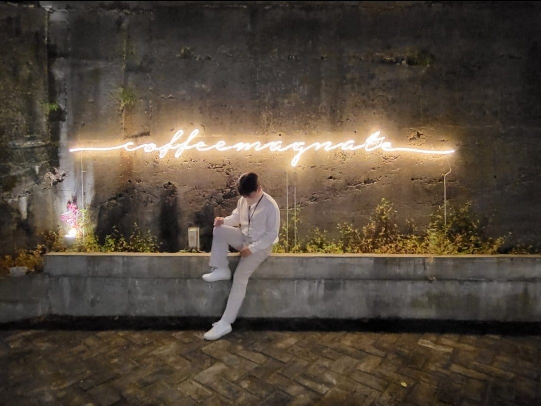 ZM-illennial café exterior illuminated at night in Busan.