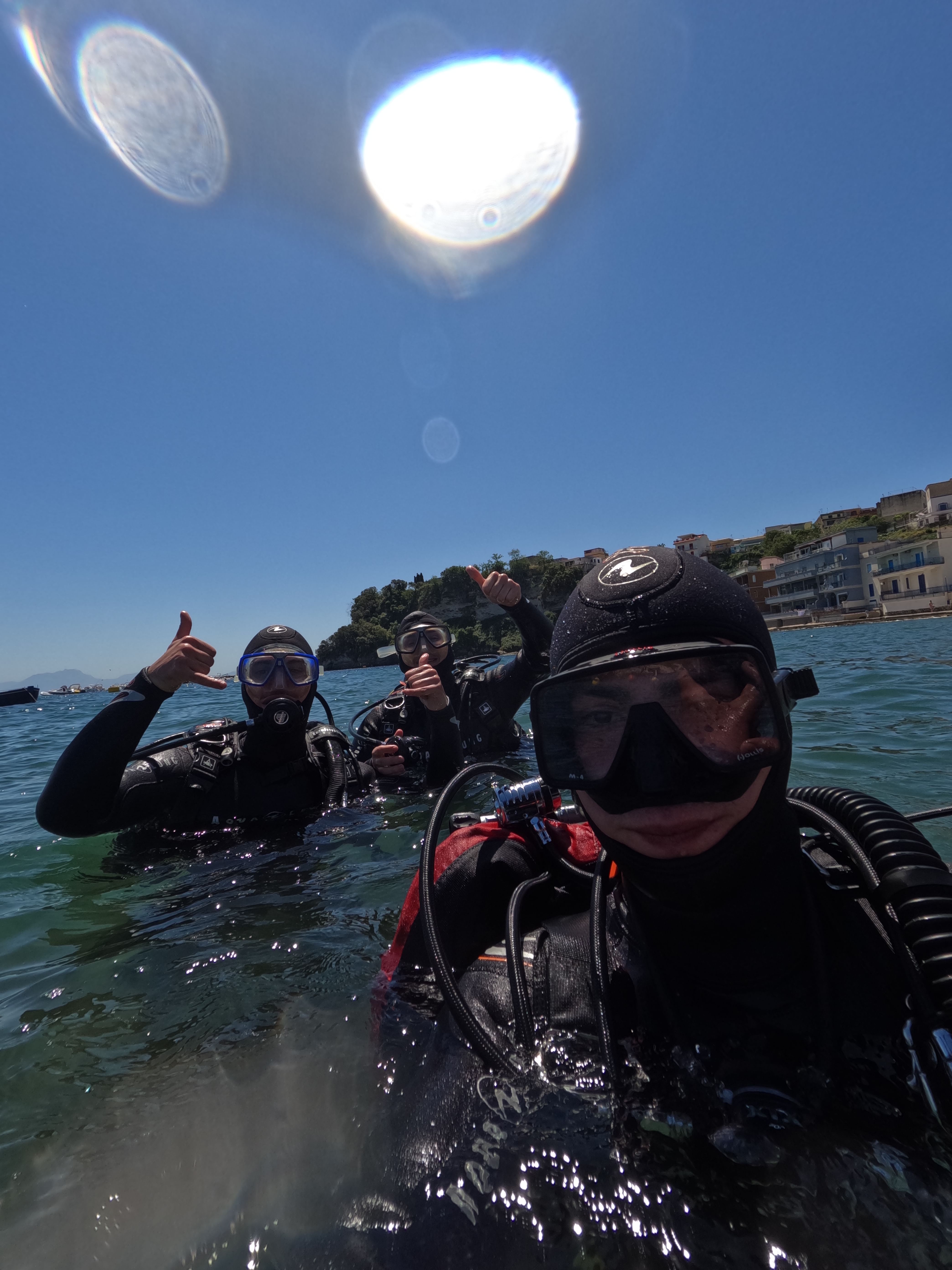 Divers on the surface, ready to dive.
