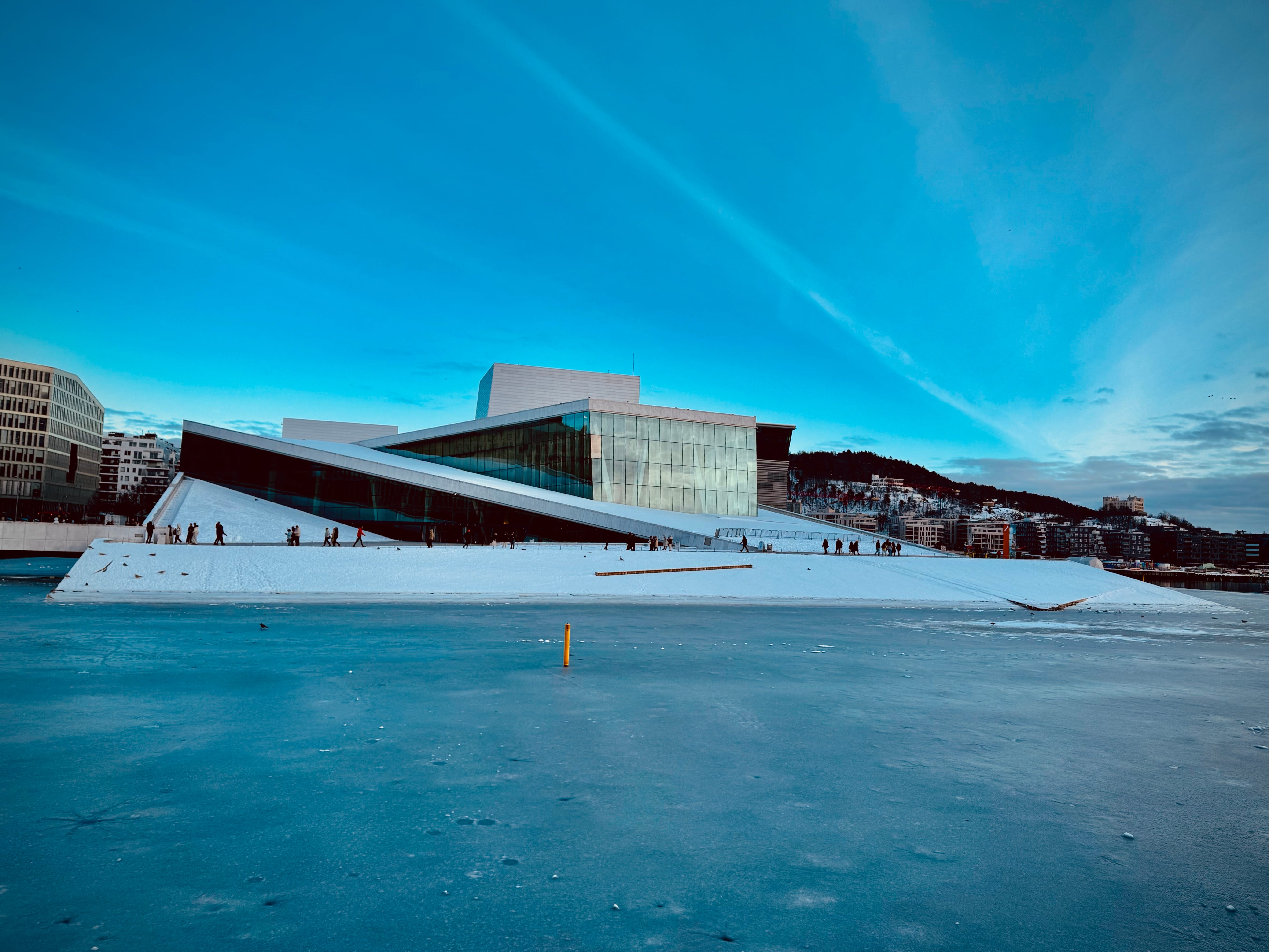 Opera in winter, with frozen water in front