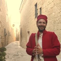Walk through the narrow streets of Mdina with your guide