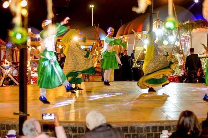 Oriental dance performance under starry skies during a desert safari in Sharm El Sheikh.