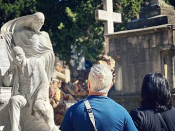 Guests on the monjtuic cemetery tour in barcelona admiring one of the stunning graves