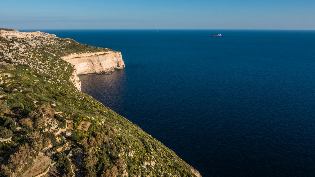 Aerial views of Dingli Cliffs and the islet of Filfla