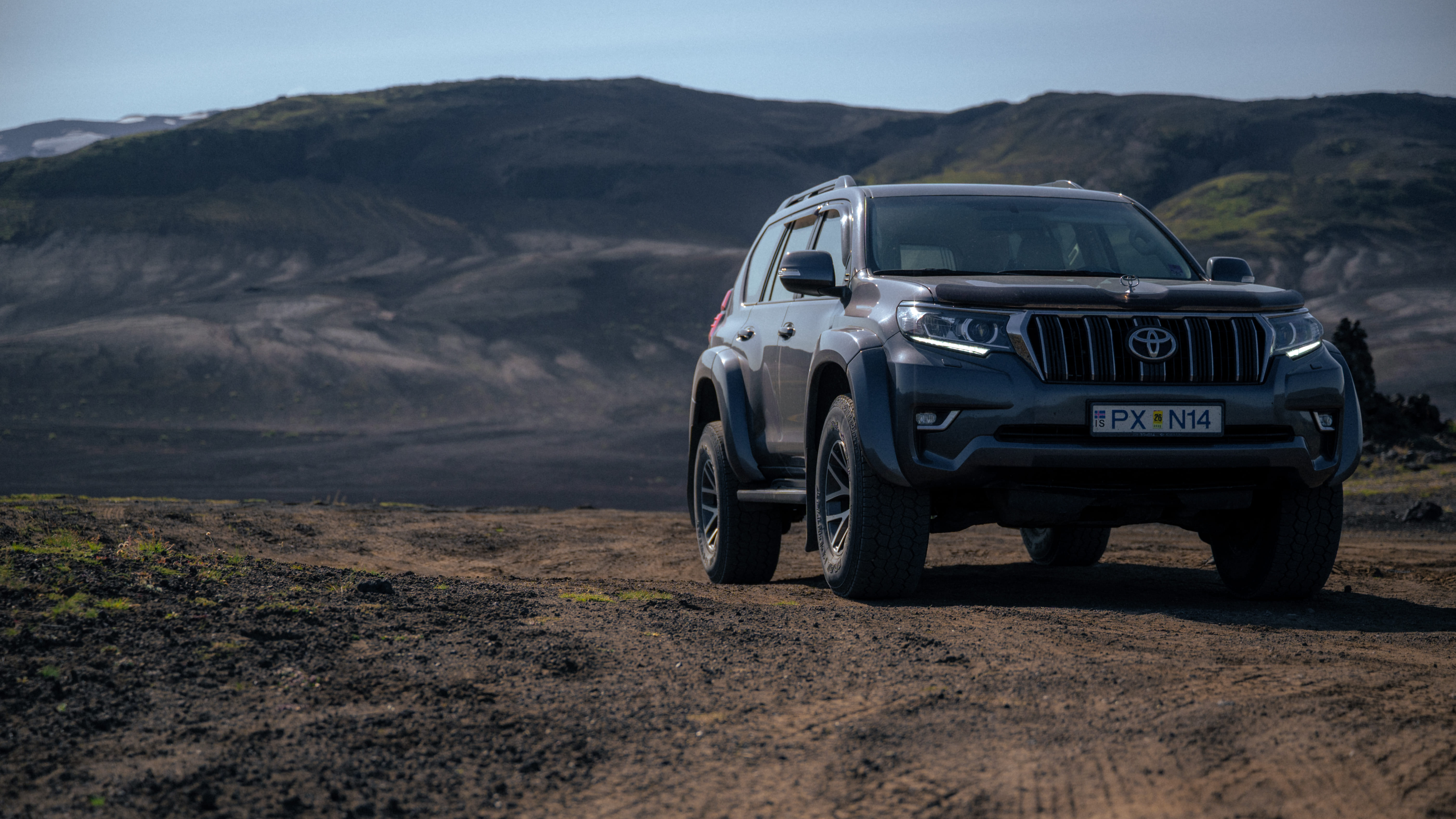 Arctic-modified Toyota Land Cruiser navigating the rocky volcanic terrain of Iceland's interior