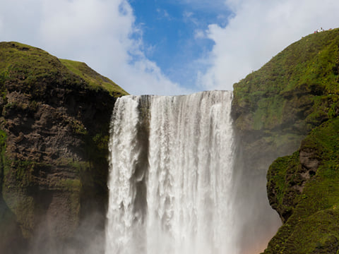 Picture of the top of Skógafoss Waterfall where water brakes and begins to fall.