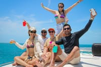 Dive into the turquoise waters for spectacular snorkeling before relaxing on your private Cancun Catamaran with an open bar!