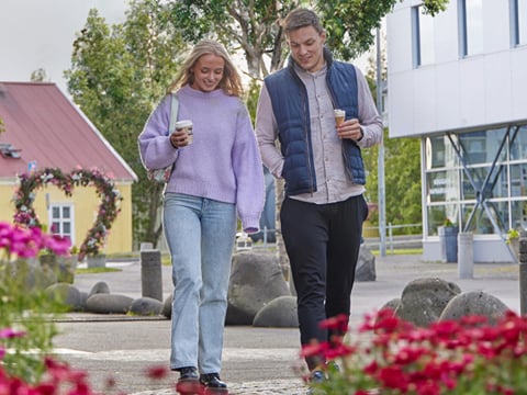 People strolling together along a quiet street