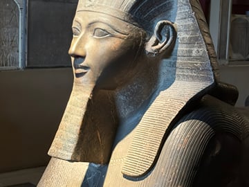 Ancient Egyptian Pharaonic bust on display inside the Egyptian Museum in Cairo.